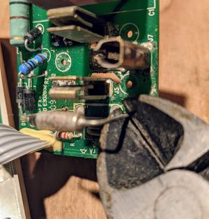 Wire cutters removing the bad fuse Wire cutters removing the bad fuse